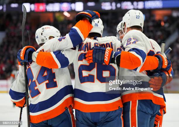 Oliver Wahlstrom of the New York Islanders celebrates his second period goal against the Ottawa Senators with teammates Anders Lee, Jean-Gabriel...