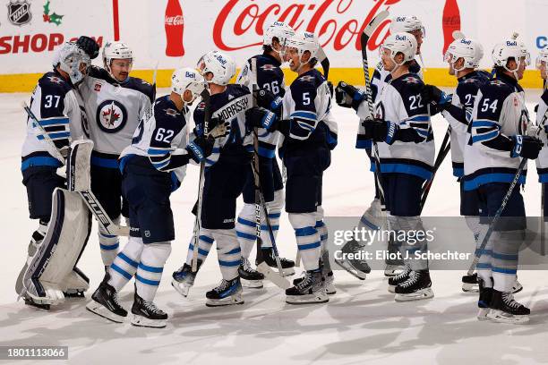 The Winnipeg Jets celebrate their 3-0 shut out win over the Florida Panthers at the Amerant Bank Arena on November 24, 2023 in Sunrise, Florida.