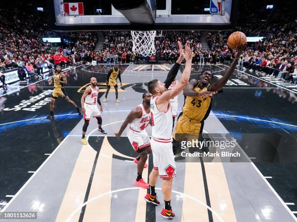 Pascal Siakam of the Toronto Raptors goes to the basket against Nikola Vucevic of the Chicago Bulls during the second half of the NBA In-Season...