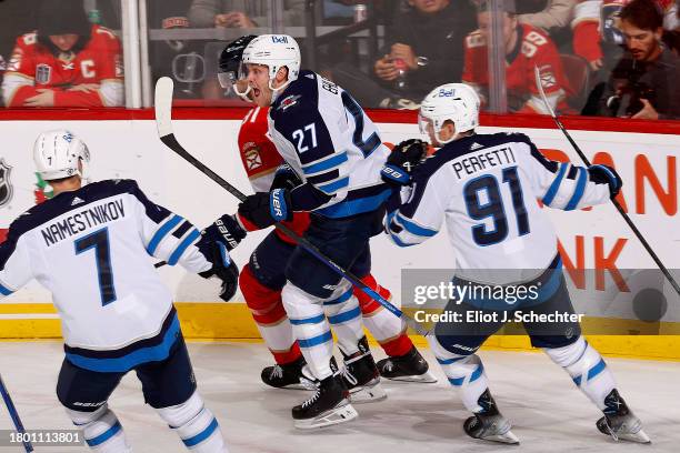 Nikolaj Ehlers of the Winnipeg Jets celebrates his goal with teammates against the Florida Panthers at the Amerant Bank Arena on November 24, 2023 in...