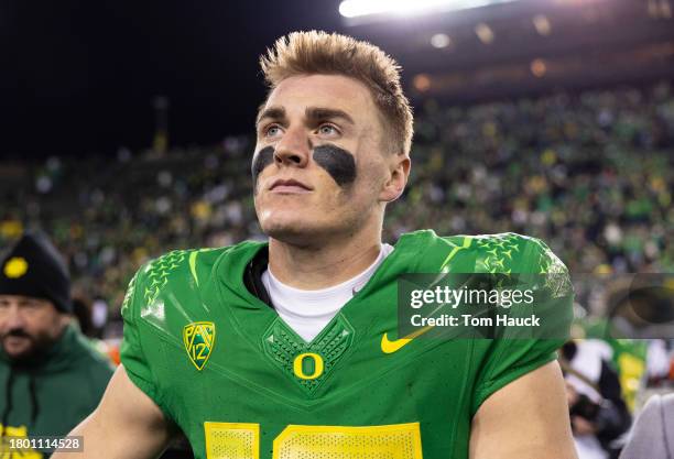 Quarterback Bo Nix of the Oregon Ducks celebrates after defeating the Oregon State Beavers 31-7 at Autzen Stadium on November 24, 2023 in Eugene,...