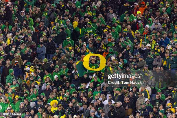 Fans of the Oregon Ducks cheer against the Oregon State Beavers during the second half at Autzen Stadium on November 24, 2023 in Eugene, Oregon.