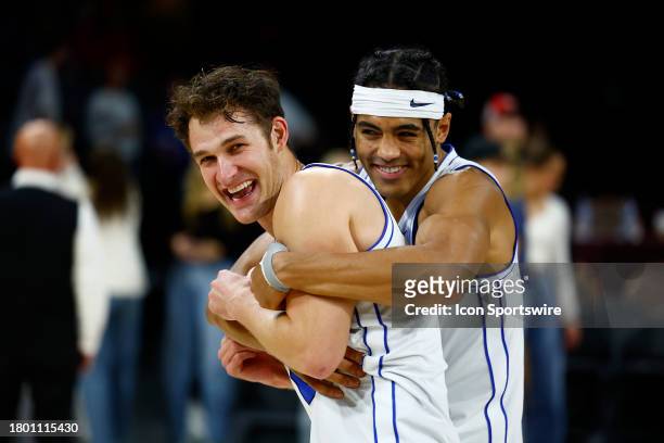 Brigham Young University Cougars guard Trevin Knell is hugged by Trey Stewart as they celebrate after winning the championship game of the Vegas...