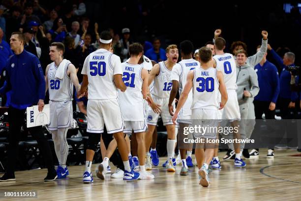 The BYU team celebrates after winning the championship game of the Vegas Showdown between the North Carolina State Wolfpack and the Brigham Young...