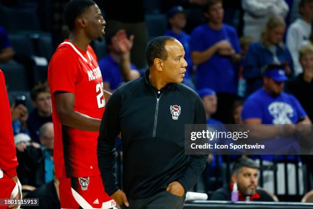 Head coach Kevin Keatts of the North Carolina State Wolfpack looks back as he walks off the court following his ejection during the championship game...