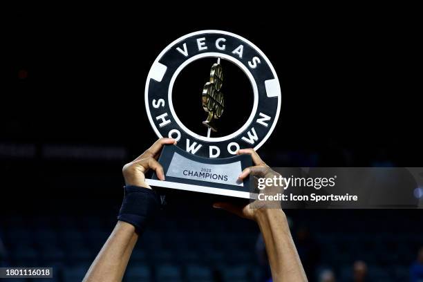 Brigham Young University Cougars forward Atiki Ally Atiki holds up the trophy after BYU won the championship game of the Vegas Showdown between the...