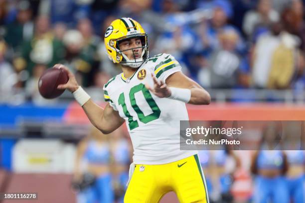 Green Bay Packers quarterback Jordan Love goes to pass the ball during an NFL Thanksgiving Day football game between the Detroit Lions and the Green...