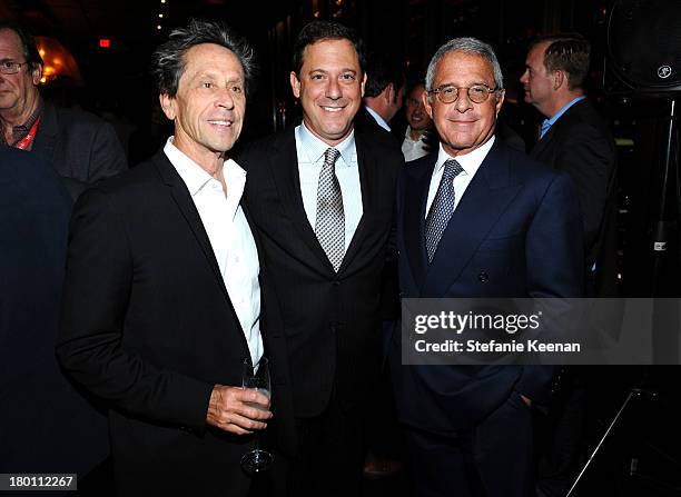 Producer Brian Grazer, Universal Pictures Chairman Adam Fogelson and head of Universal Ron Meyer at the Grey Goose vodka co-hosted party for "Rush"...
