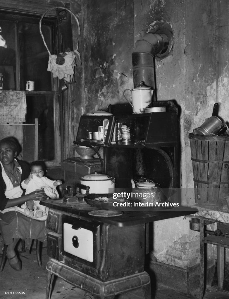 Mother And Baby In A Slum Kitchen In Washington, DC