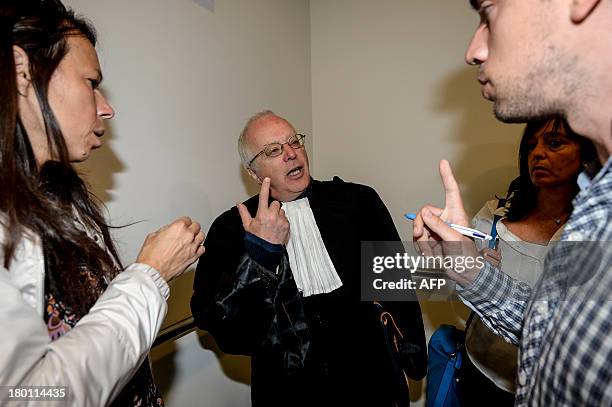 Lawyer defending the Belgian royal family, Alain Berenboom, speaks to journalists on September 9, 2013 at the Court of First Instance in Brussels....