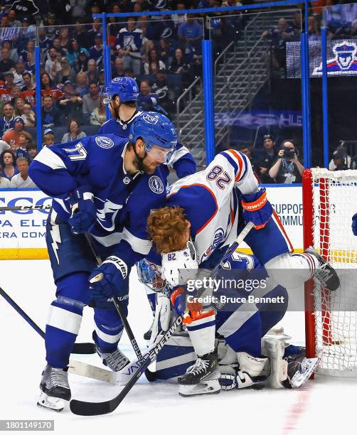 Victor Hedman of the Tampa Bay Lightning knocks the helmet off Leon Draisaitl of the Edmonton Oilers during the third period at Amalie Arena on...