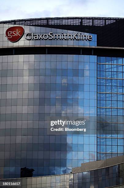 The GlaxoSmithKline company logo is seen on the GlaxoSmithKline Plc headquarters in London, U.K., on Sunday, Sept. 8, 2013. Suntory Beverage & Food...