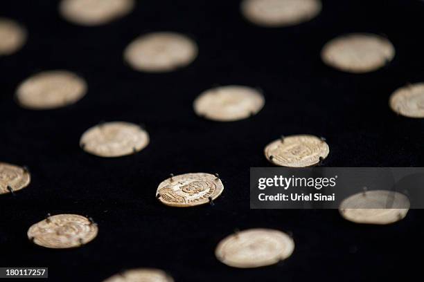 Gold coins are displayed after they were found together with an ancient medallion dated to the late Byzantine period during a press conference at the...