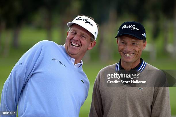 Colin Montgomerie and Bernhard Langer share a laugh during the taping of a Ben Hogan television spot during practice for the Nissan Open on February...