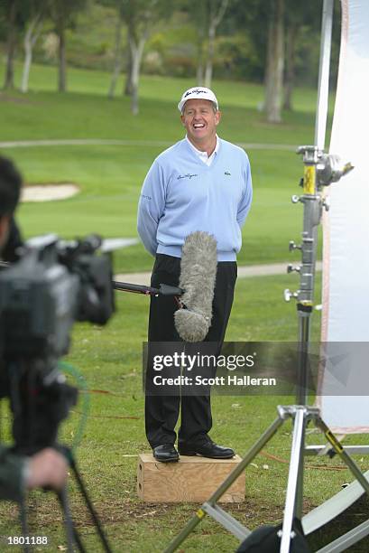 Colin Montgomerie shares a laugh during the taping of a Ben Hogan television spot during practice for the Nissan Open on February 17, 2003 at Riveria...