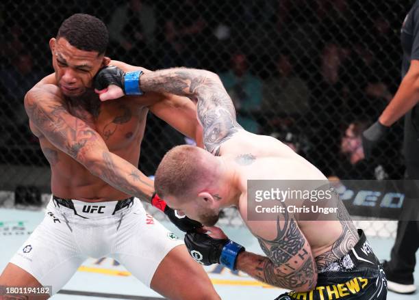 Jake Matthews of Australia punches Michael Morales of Ecuador in a welterweight fight during the UFC Fight Night event at UFC APEX on November 18,...