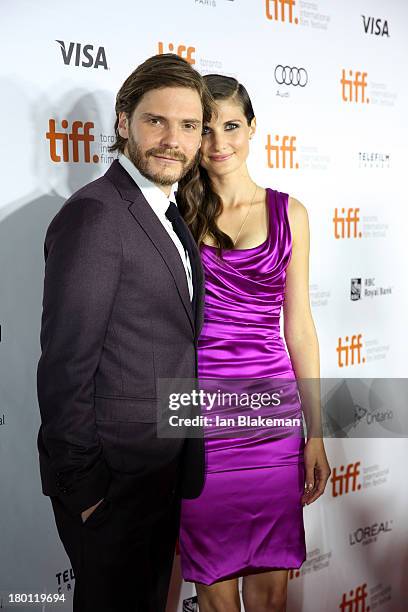 Actor Daniel Brühl and girlfriend Felicitas Rombold attend the 'Rush' premiere during the 2013 Toronto International Film Festival at Roy Thomson...