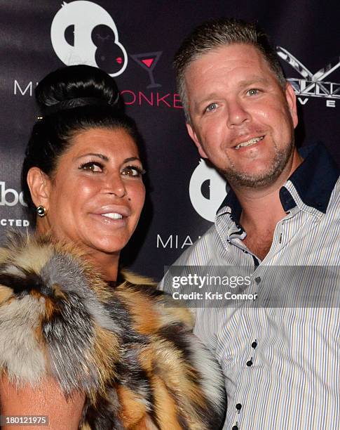 Angela "Big Ang" Raiola and Neil Murphy pose for photos during the "Miaimi Monkey" New Screening at 49 Grove on September 8, 2013 in New York City.