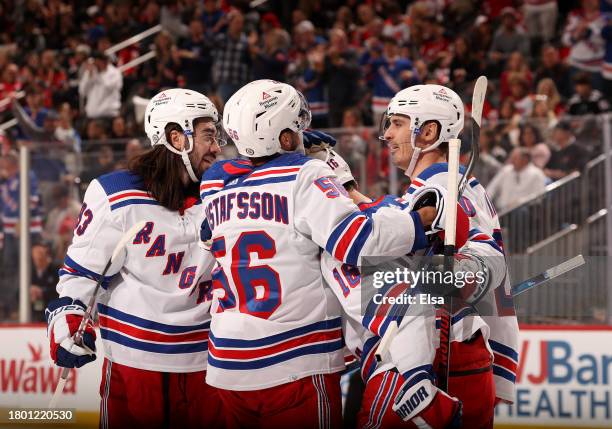 Mika Zibanejad,Erik Gustafsson,Vincent Trocheck and Chris Kreider of the New York Rangers celebrate after a goal during the first period against the...