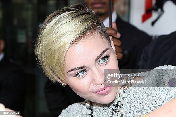 Singer Miley Cyrus is seen leaving the 'NRJ' radio station on September 9, 2013 in Paris, France.