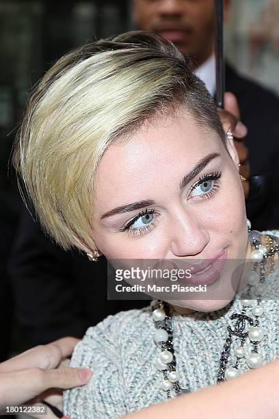 Singer Miley Cyrus is seen leaving the 'NRJ' radio station on September 9, 2013 in Paris, France.