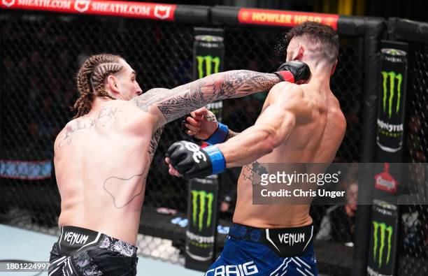 Brendan Allen punches Paul Craig of Scotland in a middleweight fight during the UFC Fight Night event at UFC APEX on November 18, 2023 in Las Vegas,...