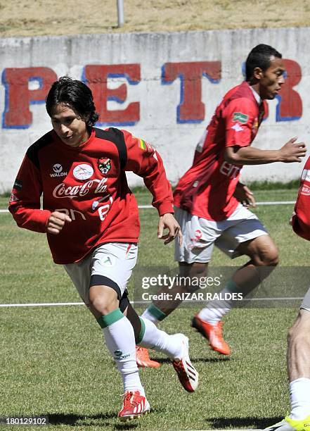 Bolivia's national football team players Marvin Bejarano, and Edemir Rodriguez take part in a training session in La Paz on September 09, 2013....