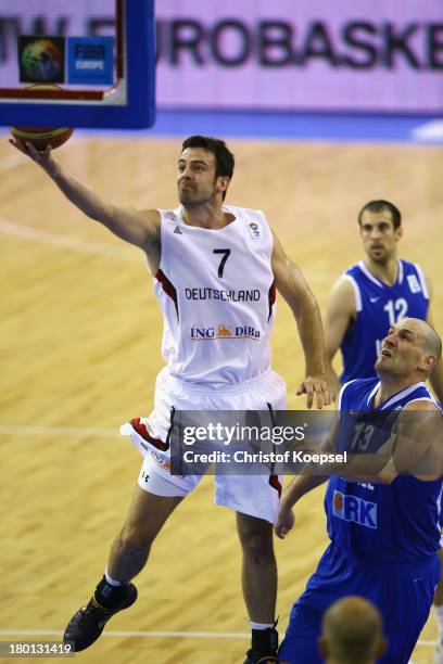 Philip Zwiener of Gemany shoots over Ido Kozikaro of Israel during the FIBA European Championships 2013 first round group A match between Germany and...