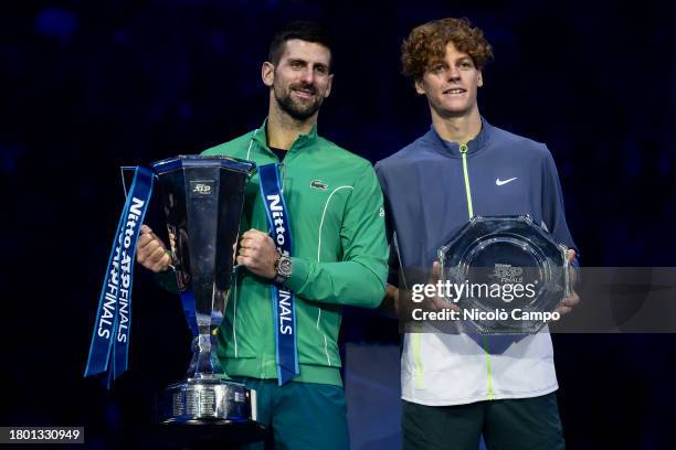 Novak Djokovic of Serbia and Jannik Sinner of Italy pose with trophies at the end of the final singles match during day eight of the Nitto ATP...