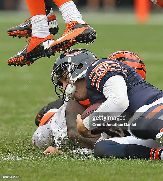 Sliding after running 18 yards for a first down, Jay Cutler of the Chicago Bears is stepped on the head by a Cincinnati Bengal defender at Soldier...