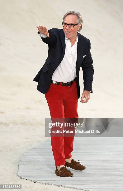 Designer Tommy Hilfiger takes a bow on the runway at the Tommy Hilfiger Women's fashion show during Mercedes-Benz Fashion Week Spring 2014 at Pier 94...