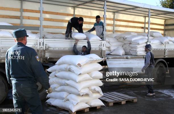 Kosovo Serbs unload a truck of a Russian aid convoy in the northern Kosovo city of Zvecan on December 16, 2011. The convoy of Russian aid destined...