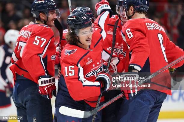 Sonny Milano of the Washington Capitals celebrates after scoring a goal with teammates against the Columbus Blue Jackets during the second period at...