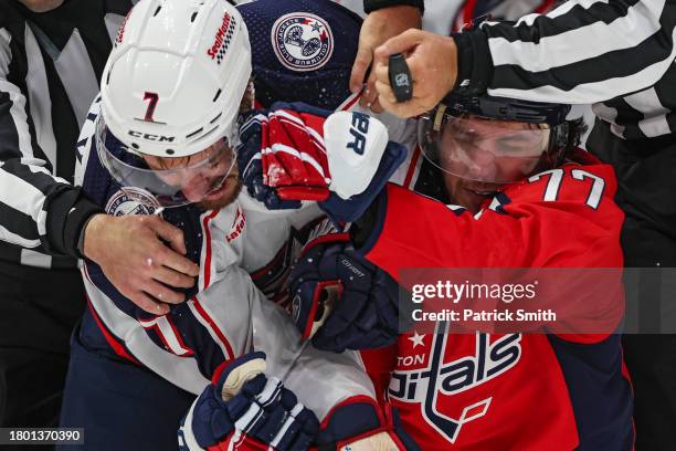 Oshie of the Washington Capitals and Sean Kuraly of the Columbus Blue Jackets grapple and punch during the second period at Capital One Arena on...