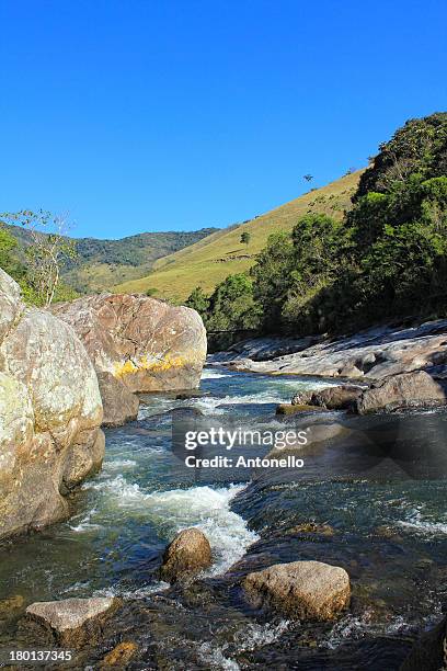 River Rocks And Green Fields, Foto de stock