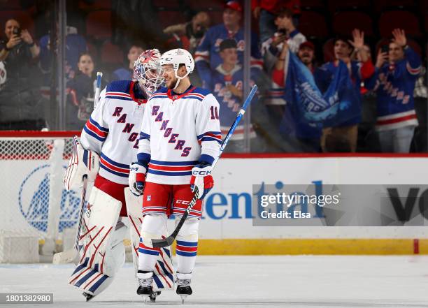 Igor Shesterkin and Artemi Panarin of the New York Rangers celebrate the win over the New Jersey Devils at Prudential Center on November 18, 2023 in...
