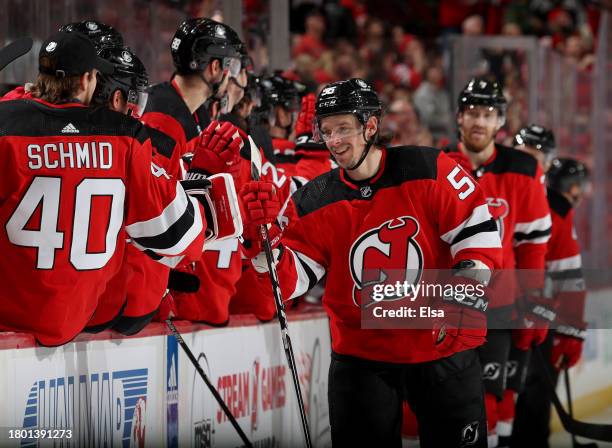Erik Haula of the New Jersey Devils is congratulated by teammates after he scored during the third period against the New York Rangers at Prudential...