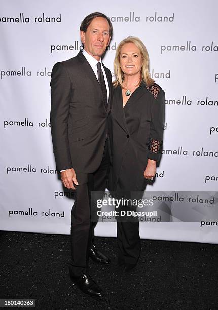 Dan De Vos and Pamella Roland pose backstage at the pamella roland Spring 2014 fashion show during Mercedes-Benz Fashion Week on September 9, 2013 in...