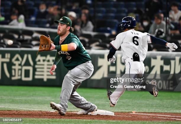 Infielder Tzu Ting Yeh of Chinese Taipei hits a single in the bottom of the third inning during the Asia Professional Baseball Championship third...