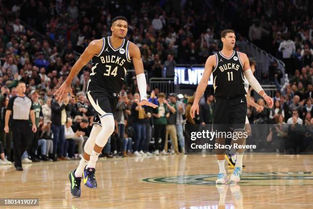 Giannis Antetokounmpo of the Milwaukee Bucks reacts to a score against the Dallas Mavericks during the second half of a game at Fiserv Forum on...