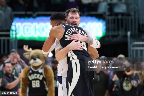 Giannis Antetokounmpo of the Milwaukee Bucks hugs Luka Doncic of the Dallas Mavericks after the Bucks defeated the Mavericks 132-12 at Fiserv Forum...