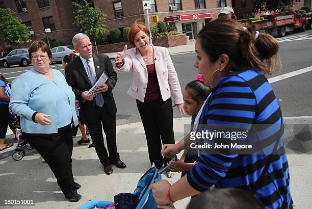 New York City mayoral candidate Christine Quinn meets potential voters outside a school on September 9, 2013 in the Queens borough of New York City....