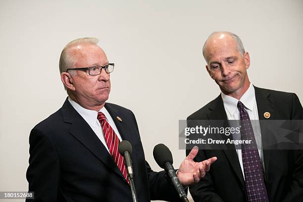 Chairman of the House Armed Services Committee U.S. Rep. Buck McKeon and Ranking Member U.S. Rep. Adam Smith talk to reporters after a joint House...