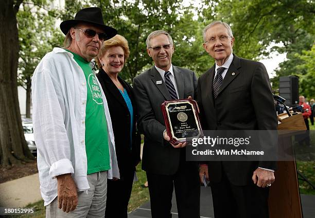 Musician Neil Young, U.S. Sen. Debbie Stabenow , National Farmers Union President Roger Johnson, and Senate Majority Leader Harry Reid present Reid...