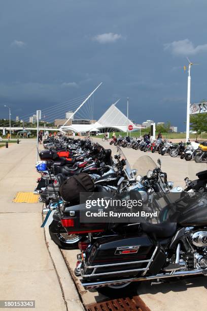 Hundreds of Harley-Davidson motorcycles from around the world, line the streets outside Discovery World with the Milwaukee Art Museum in the...