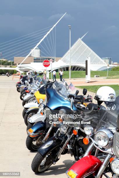 Hundreds of Harley-Davidson motorcycles from around the world, line the streets outside Discovery World with the Milwaukee Art Museum in the...