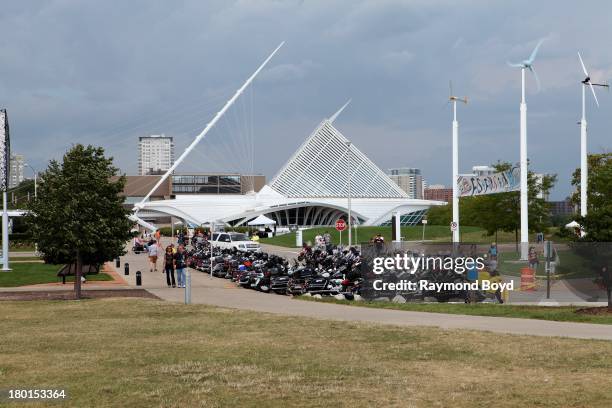 Hundreds of Harley-Davidson motorcycles from around the world, line the streets outside Discovery World with the Milwaukee Art Museum in the...