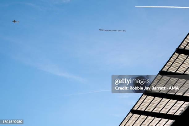 Plane flies over the Etihad Stadium with a message reading 'Premier League = Corrupt' in relation to the docked points of Everton during the Premier...