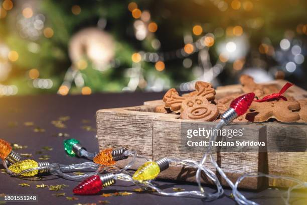 christmas gingerbread cookies and lights - biscuit tin stock pictures, royalty-free photos & images