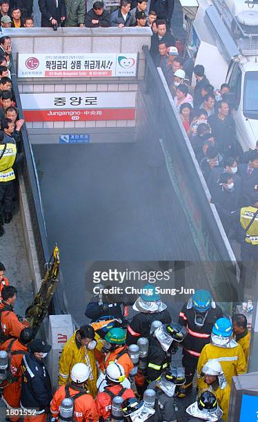 South Korean rescue workers prepare to enter a subway station looking for surviors February 18, 2003 in Daegu, 200 miles southeast of Seoul, South...